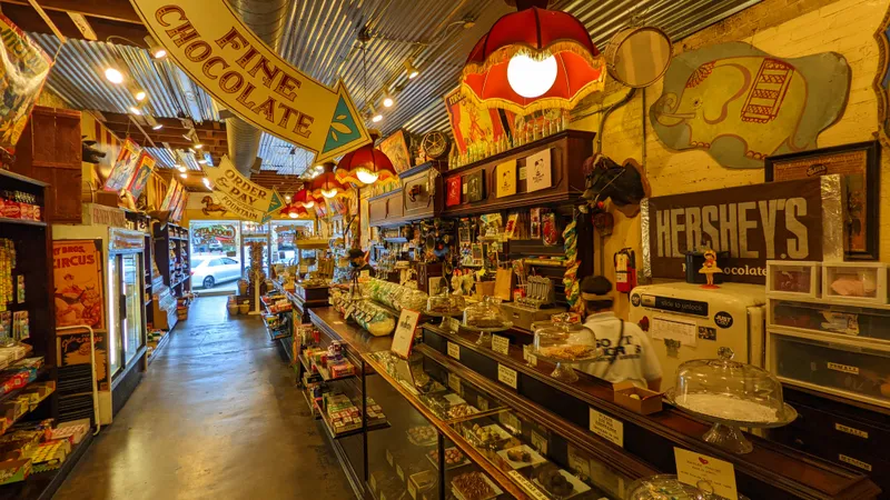 Interior of a charming candy and chocolate shop with displays of sweets and vintage decor.