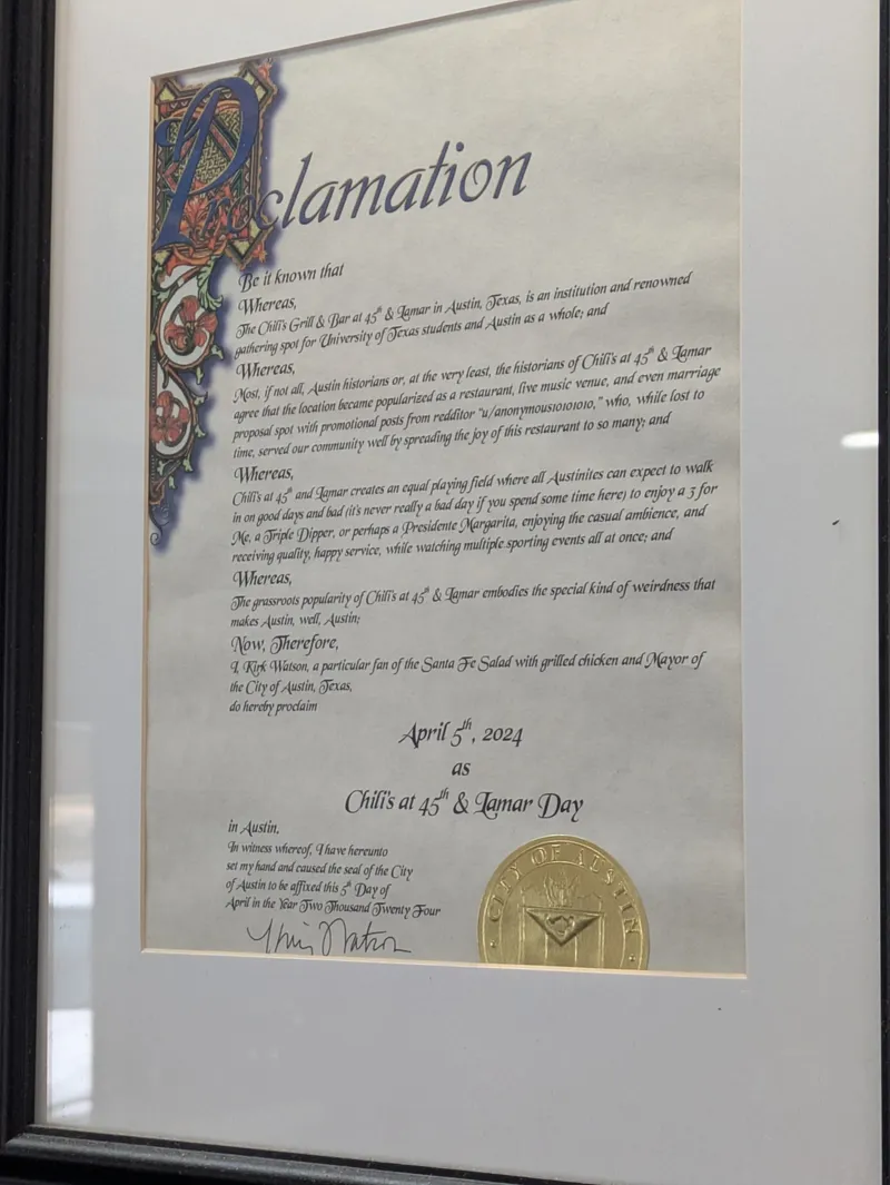 A framed proclamation declaring April 5th as Chili's at 45th & Lamar Day in Austin, Texas.